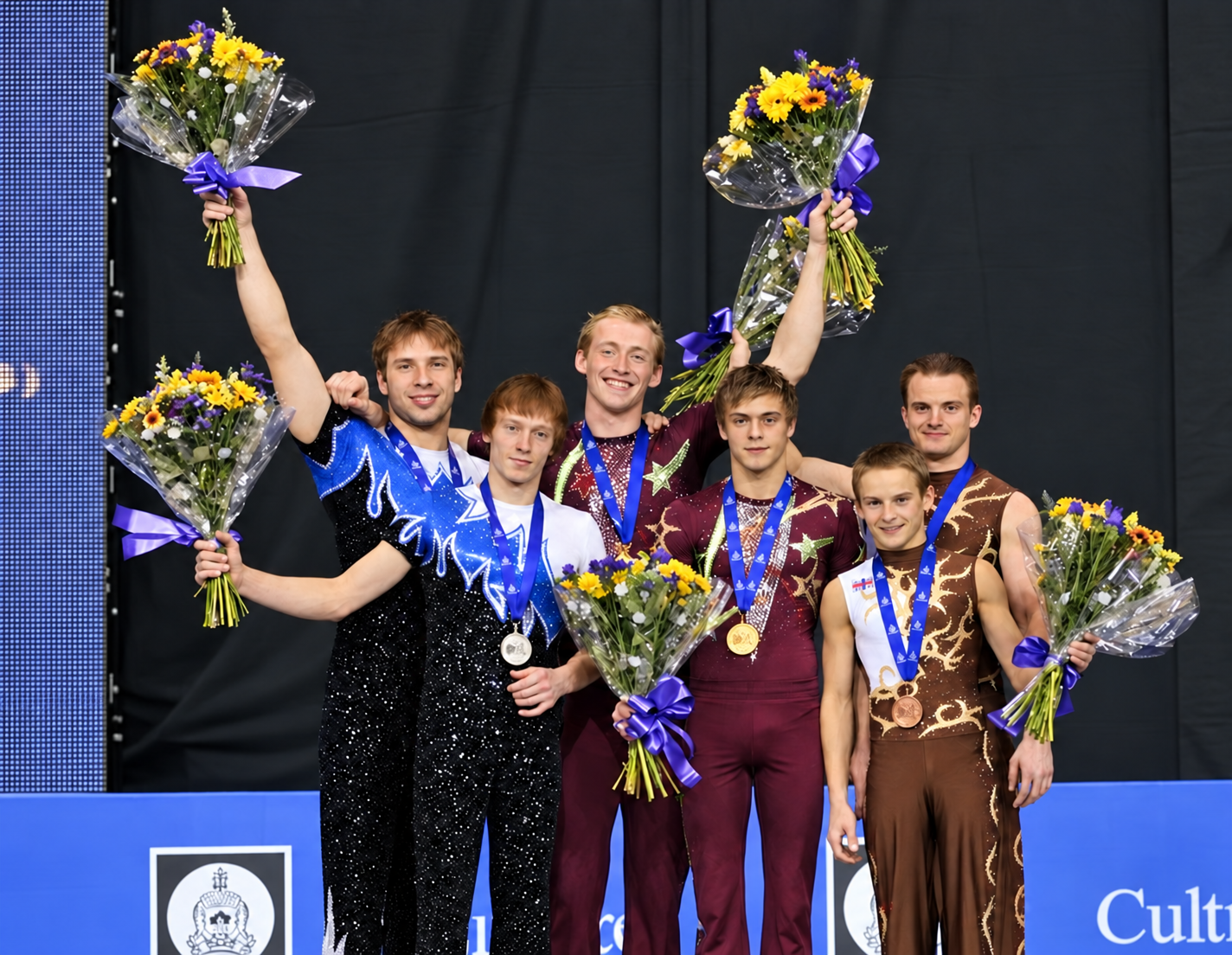 Sports acrobatics champions celebrating with medals and flowers
